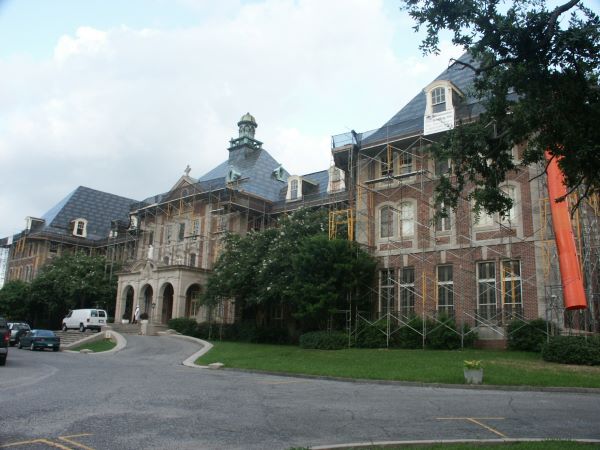 Scaffolding surrounds the buildings at Notre Dame Seminary as workers prepare to fix the damaged roof. (BRANDON BRISCOE)